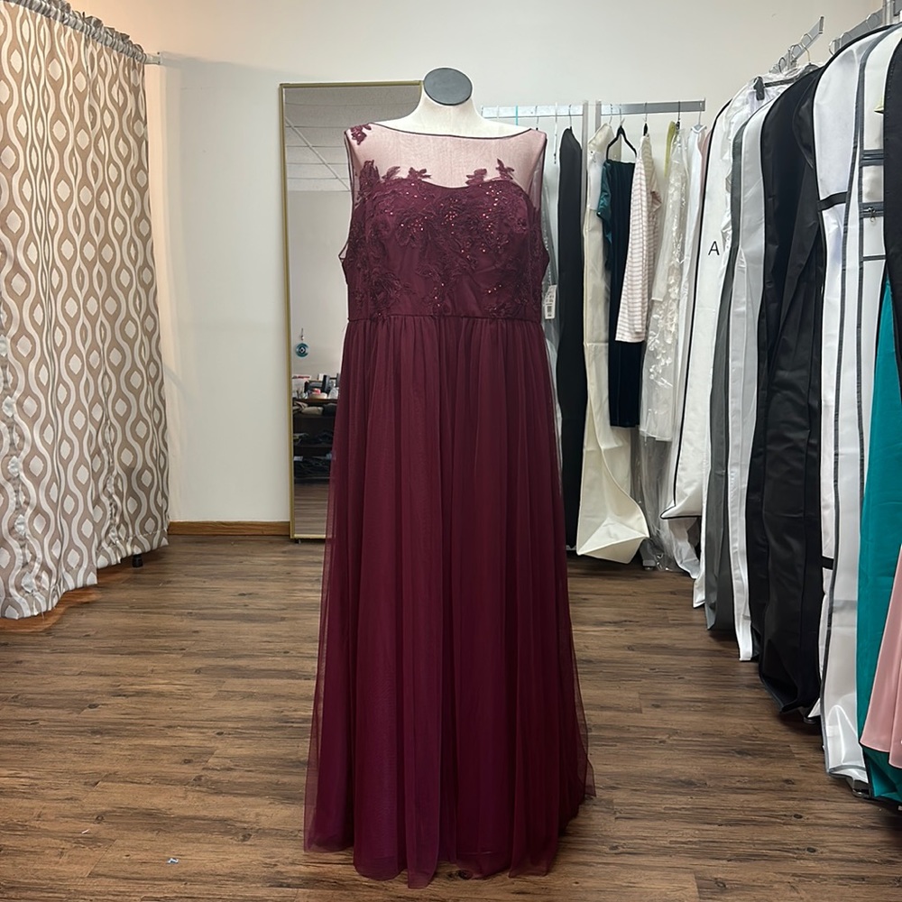 Brand new with tags. David’s Bridal Dress Size 24